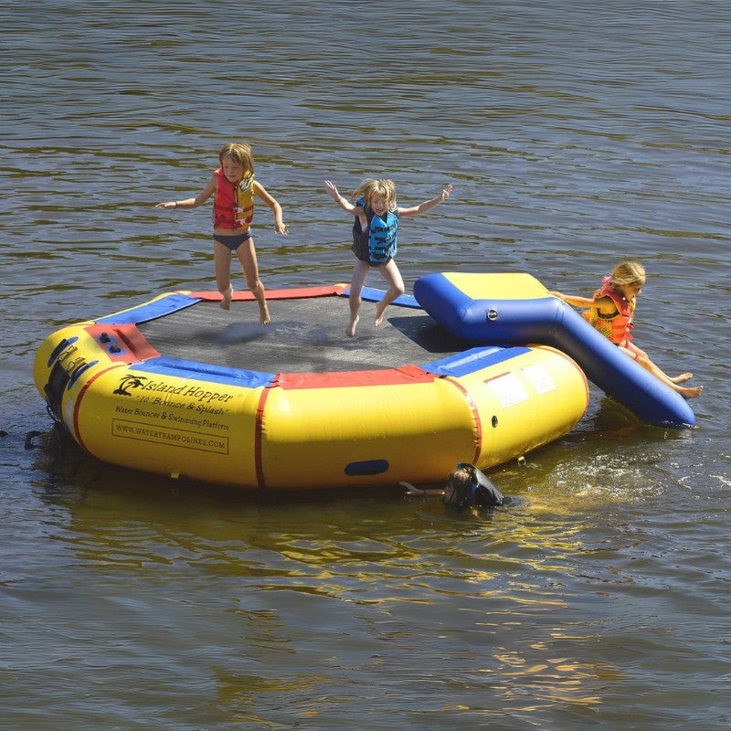 Island Hopper 10' Bounce and Splash Water Park w/ Slide - Showing the kids jumping and sliding to the water park