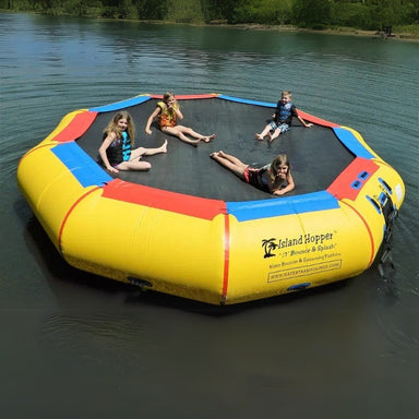 Island Hopper 17' Bounce and Splash Water Bouncer - Showing a group of kids relaxing on the water bouncer