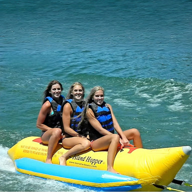 Island Hopper 3 Person Banana Boat Tube - Three girls enjoying the ride on the banana boat