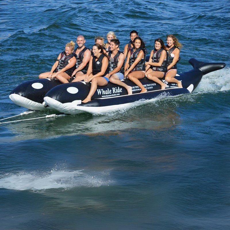 Island Hopper Elite Class 10 Person Whale Ride Banana Boat - A group of friends enjoying a ride on the whale banana boat at the beach