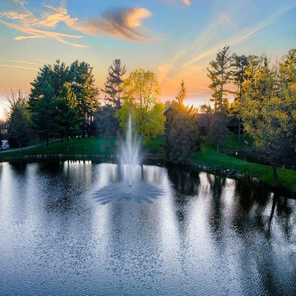 Scott Aerator Amherst Nozzle - On Water Spray Pattern Display Top View with Beautiful Sky at the Background