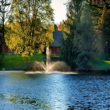 Scott Aerator Baystone Nozzle - On Water Displaying Spray Pattern