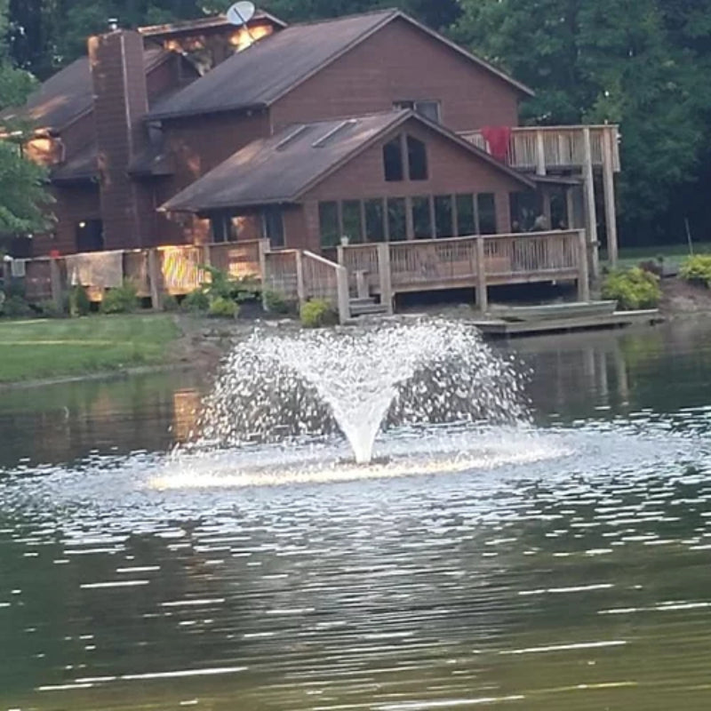 Vanguard Typhoon 3/4 HP Floating Display Aerator On Water Display with Brown House at the Background
