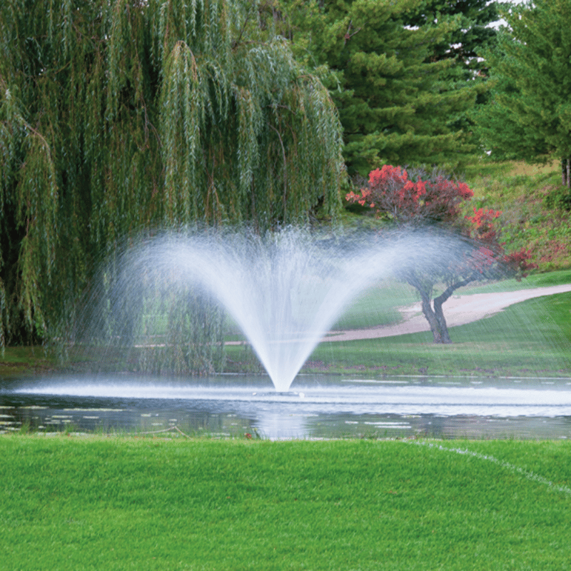 Kasco VFX Series Fountain - On Water with Green Trees and Grass at the Background