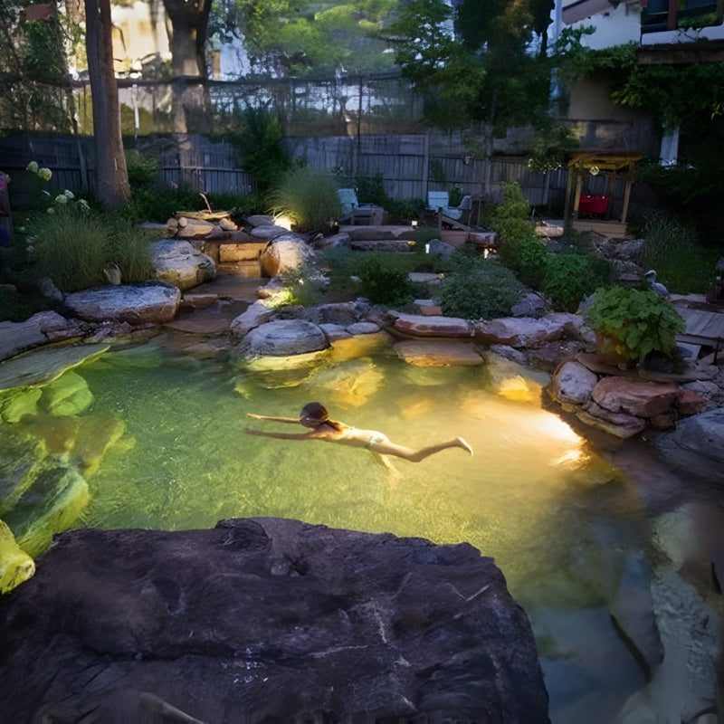Aquascape Recreational Pond Kit illuminated backyard swimming pond with underwater lighting