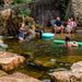 Family enjoying a natural swimming pond built with the Aquascape Recreational Pond Kit
