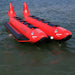 Island Hopper 10 Person Red Shark Banana Boat - Showing the front and top view of the banana boat on the water 