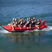 Island Hopper 10 Person Red Shark Banana Boat - Showing the group of friends enjoying the ride on the banana boat