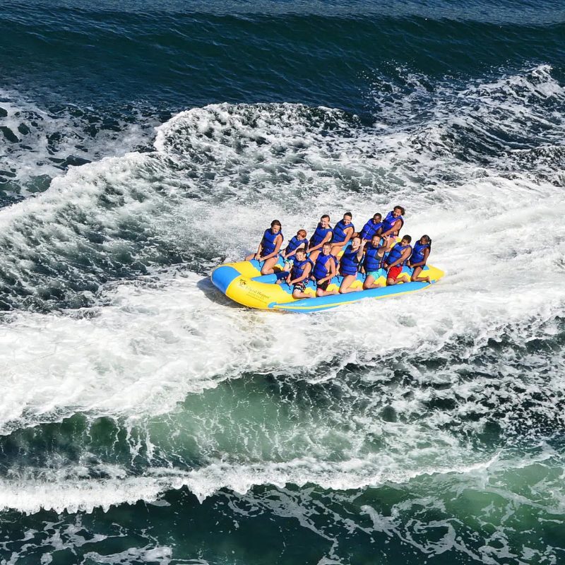 Island Hopper 12 Person Banana Taxi Banana Boat - Group of friends enjoying the ride on the taxi banana boat - top view
