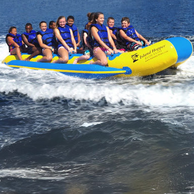 Island Hopper 12 Person Banana Taxi Banana Boat - Showing the teenagers having fun riding the taxi banana boat