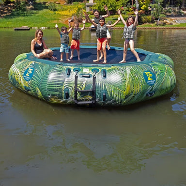 Island Hopper 15' Lakeside Water Bouncer - Showing family members enjoying the water bouncer by the lakeside