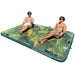Island Hopper 15' Lakeside Water Park - Shown with two people sunbathing on the water platform