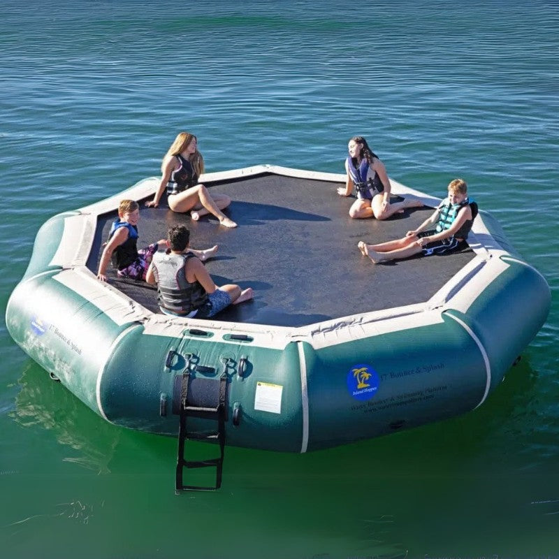 Island Hopper 17' Bounce and Splash Water Bouncer - Showing a group of teenagers sitting on the water bouncer