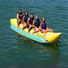 Island Hopper 5 Person Banana Boat Tube - Group of friends are enjoying the ride on the banana boat
