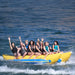 Island Hopper Elite Class 10 Person Banana Boat - Showing group of friends enjoying the ride on the banana boat
