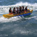 Island Hopper Elite Class 10 Person Banana Boat - Showing group of friends enjoying the ride on the banana boat rear view
