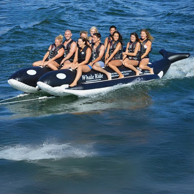 Island Hopper Elite Class 10 Person Whale Ride Banana Boat - A group of friends enjoying a ride on the whale banana boat at the beach