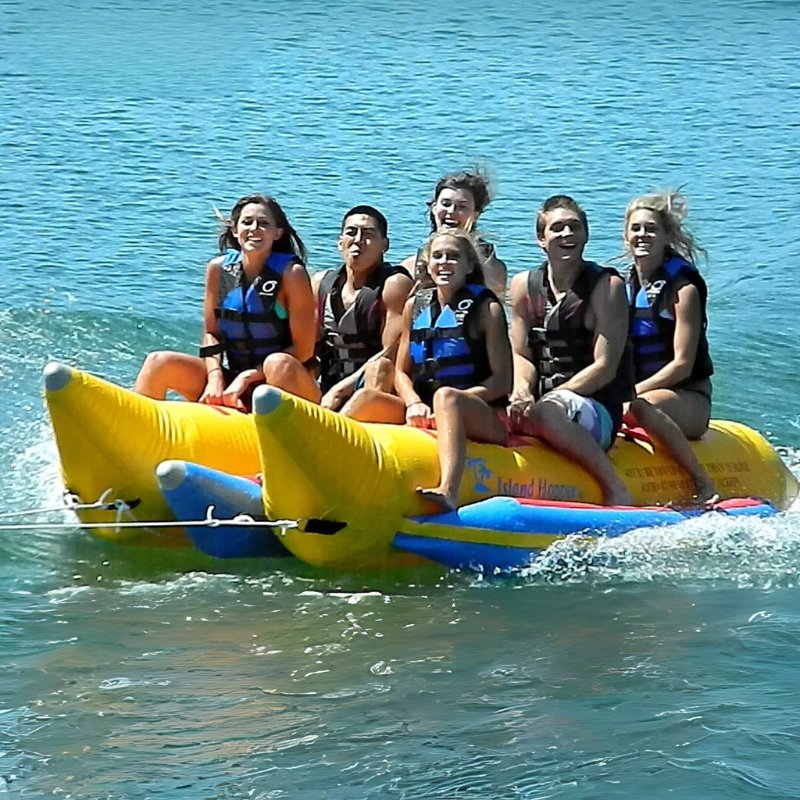 Island Hopper Elite Class 6 Person Double Banana Boat - Showing group of friends enjoying the ride on the double banana boat