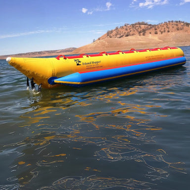 Island Hopper Elite Class 8-Person Banana Boat Tube - Side view of the banana boat on the water