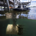 Kasco AquatiClear system installed beneath a dock with submerged motor unit visible below the water surface