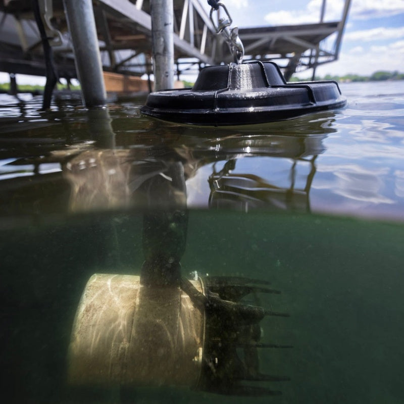 Kasco AquatiClear system installed beneath a dock with submerged motor unit visible below the water surface