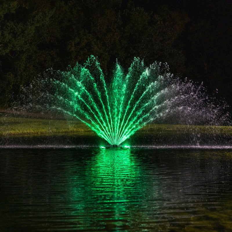Kasco Fern Fountain Masterpiece Bundle with green LED lighting on pond at night