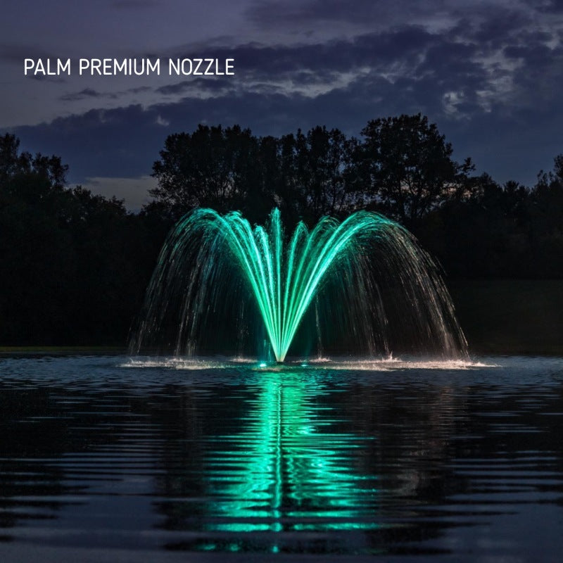 Kasco J Series Fountain with Palm Premium Nozzle illuminated at night with teal lighting