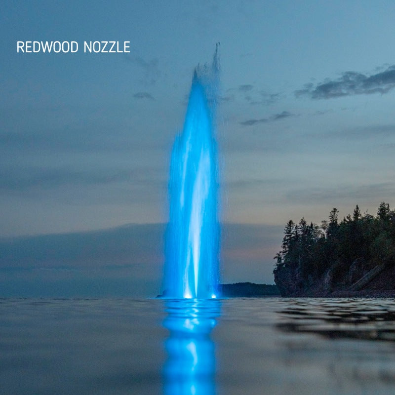 Kasco J Series Fountain with Redwood Nozzle illuminated at night with blue lighting on open lake