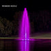 Kasco J Series Fountain with Redwood Nozzle illuminated at night with purple lighting on golf course pond