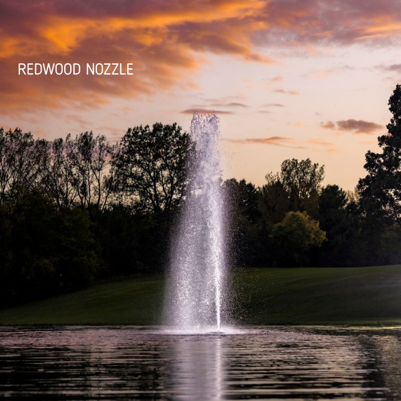 Kasco J Series Fountain with Redwood Nozzle spray pattern at sunset over a golf course pond