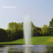 Kasco J Series Fountain with Spruce Nozzle spray pattern in daytime summer golf course pond setting