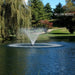 Kasco J Series Fountain with Willow Nozzle spray pattern in daytime autumn golf course pond beside willow tree