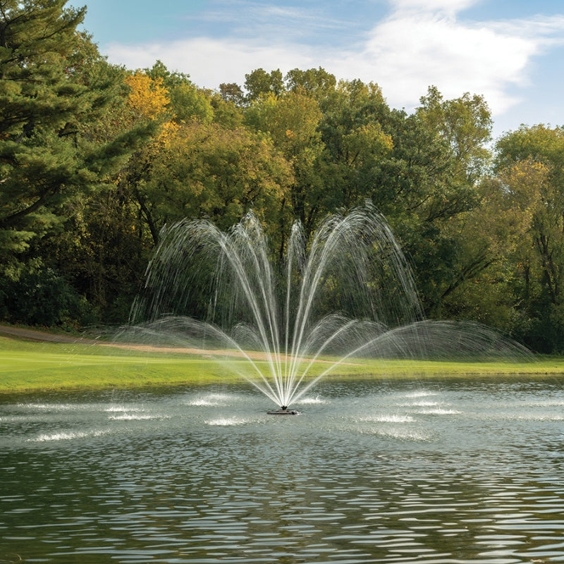 Kasco J Series Magnolia Premium Fountain Nozzle - On Water Display w/ Trees at the Background