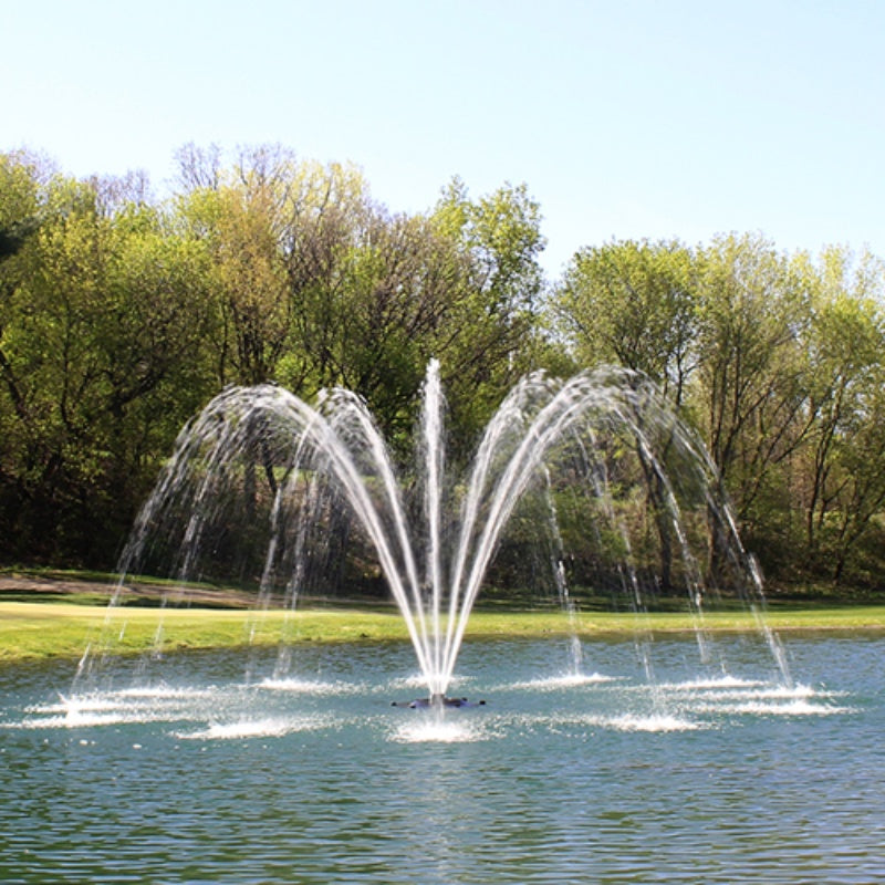 Kasco J Series Palm Premium Fountain Nozzle - On Water Display w/ Trees at the Background