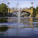Kasco Mahogany Fountain Masterpiece Bundle spray pattern in daytime urban waterway near historic bridge