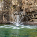 Kasco Mighty Oak Fountain Masterpiece Bundle spray pattern in daytime rocky cliff waterway setting
