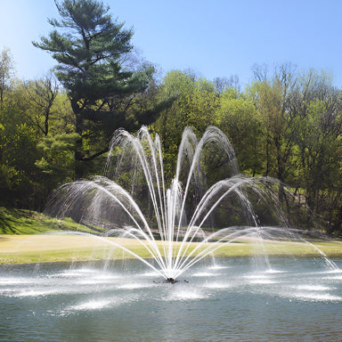 Kasco Mighty Oak Fountain spray pattern in daytime spring golf course pond setting