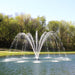 Kasco Palm Premium Fountain Nozzle - On Water Display w/ Trees at the Background