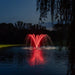 Kasco Palm Premium Fountain Nozzle with red LED lighting glowing across pond surface