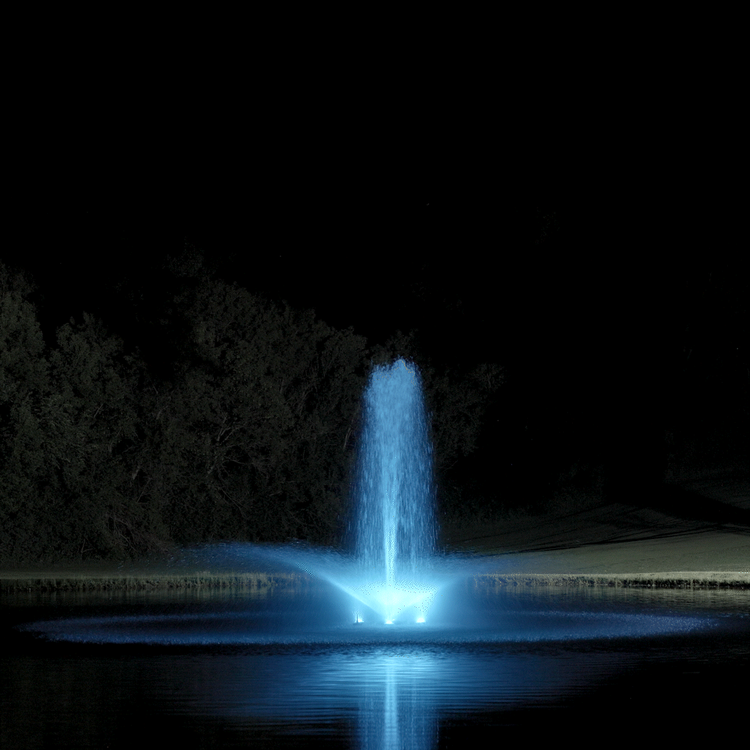 Kasco RGBW LED Lighting - RGBW18 LED Lighting System illuminating a pond fountain with bright white light at night