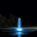 Kasco RGBW LED Lighting - RGBW18 LED Lighting System illuminating a pond fountain with bright white light at night