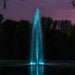 Kasco RGBW LED Lighting - RGBW18 LED Lighting System illuminating a tall vertical pond fountain in teal during dusk
