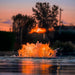 Kasco RGBW LED Lighting - RGBW18 LED Lighting System illuminating the surface aerator with amber light at sunset