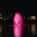 Kasco RGBW LED Lighting - RGBW18 LED Lighting System lighting a residential lake fountain in bright pink at night