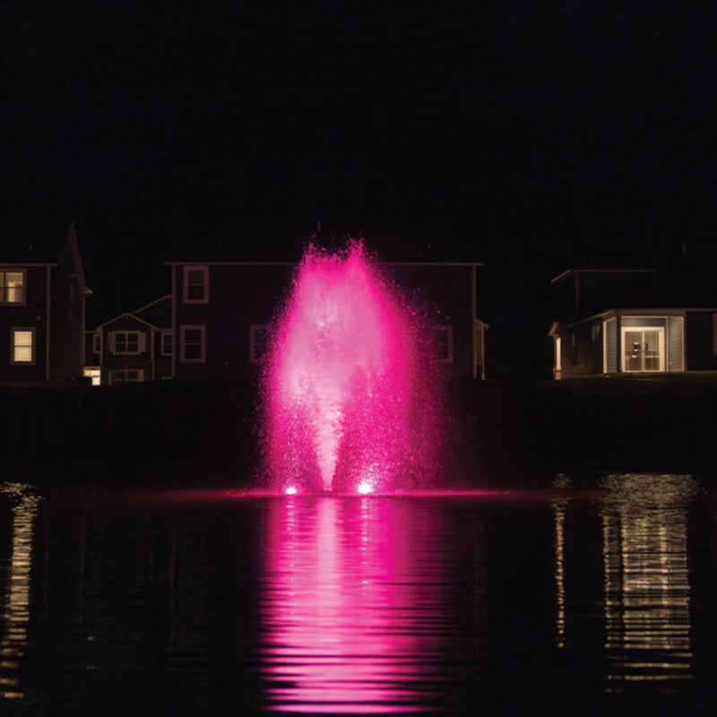Kasco RGBW LED Lighting - RGBW18 LED Lighting System lighting a residential lake fountain in bright pink at night