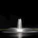 Kasco RGBW LED Lighting - W25 White LED Lighting System illuminating a vertical pond fountain with bright white light at night