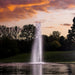 Kasco RGBW LED Lighting - W25 White LED Lighting System lighting a tall vertical pond fountain at sunset