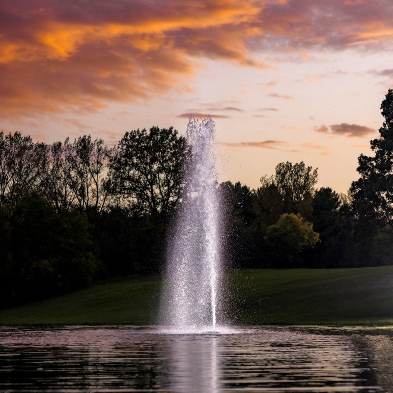 Kasco RGBW LED Lighting - W25 White LED Lighting System lighting a tall vertical pond fountain at sunset