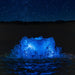 Kasco RGB LED Lighting creating blue illuminated bubbling water feature under a night sky