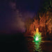 Kasco RGB LED Lighting illuminating a decorative pond fountain with vibrant multicolor display under a starry night sky